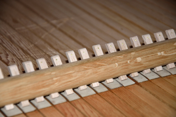 masselotte permettant d'accoupler les claviers du grand orgue et du récit